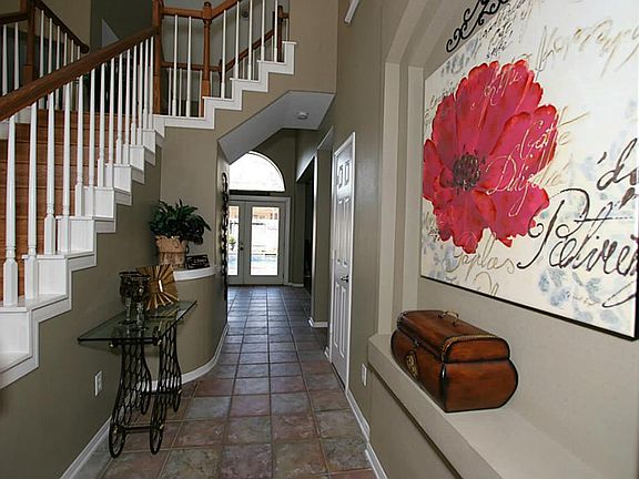 A view of the foyer leading to the family room and gourmet kitchen.