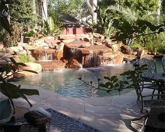 Beautiful pool with a gorgeous garden to go along with it