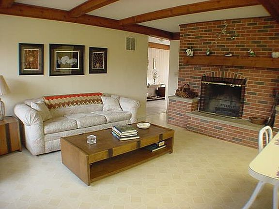 SECOND FAMILY ROOM OPEN TO THE KITCHEN WITH MASONRY FIREPLACE!