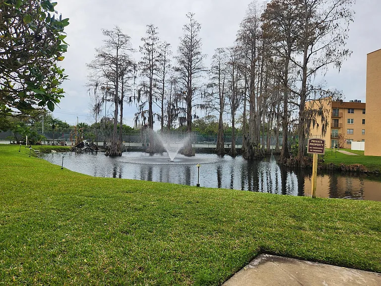 Pond and tennis courts behind it