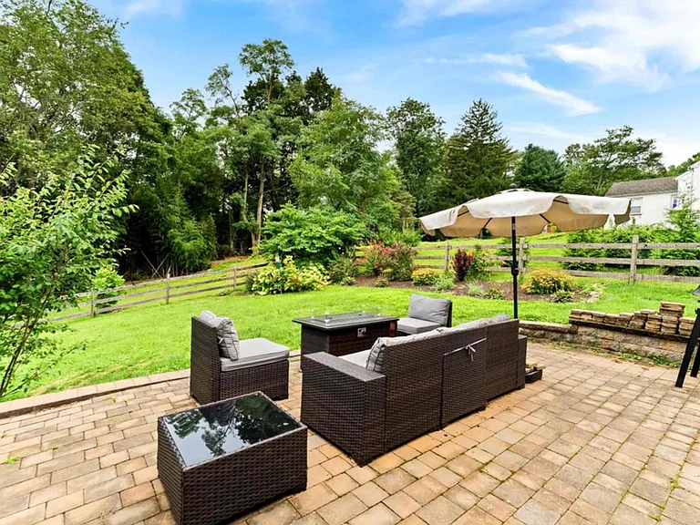 Backyard with patio furniture, grill, and propane fire pit. Perfect for watching all the wildlife!
