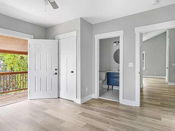 The master bedroom, with the private deck on the left and the en suite bathroom straight ahead