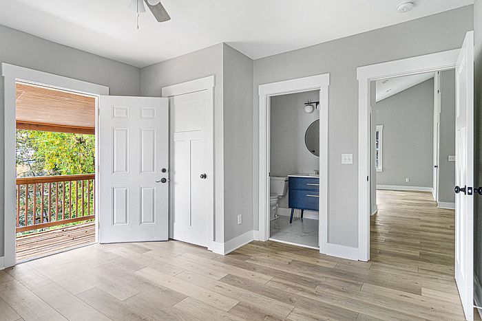 The master bedroom, with the private deck on the left and the en suite bathroom straight ahead