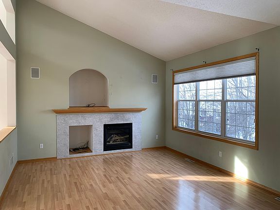 Light filled main floor family room with gas burning fireplace