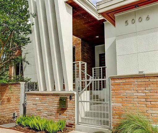 Substantially renovated and redesigned by the sellers with distinctive Contemporary flair, this raised, one-story structure offers cantilevered, sculptural exterior framing across the front elevation and an open-spaces, light-filled floorplan enhance