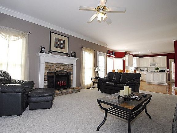 Open floor plan; huge island in kitchen; stone fireplace in cozy family room