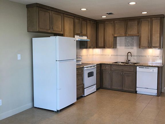 Kitchen. Custom cabinets to the ceiling. Under cabinet lighting.