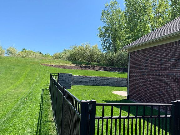 CUSTOM LANDSCAPED AND FENCED