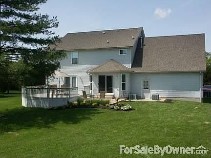Back view of house with deck and patio. : Concrete Patio is 13.5X13.5 ft. Deck is 18X24 ft. Beautifu