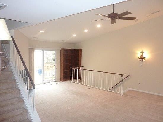 Living room from dinning room. Recessed lights throughout condo.