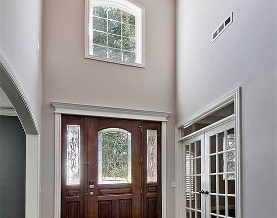 Exquisitely Grand, Extra Wide Entrance Featuring Gorgeous, Richly Wooded Front Door with Designer Etched Glass Greet Your Guests with Aplomb...