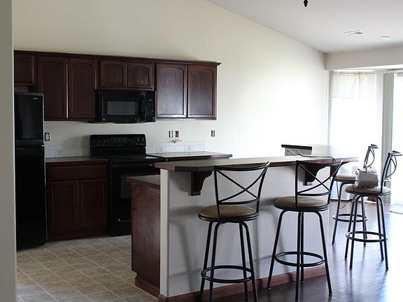 open kitchen to dinning/living room with counter for eating