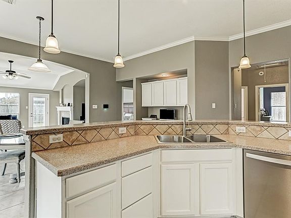 Open Sweeping Kitchen To Family Areas*Pendant Lights Over The Bar Area.