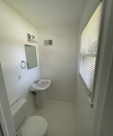 Half bathroom located in the primary bedroom
