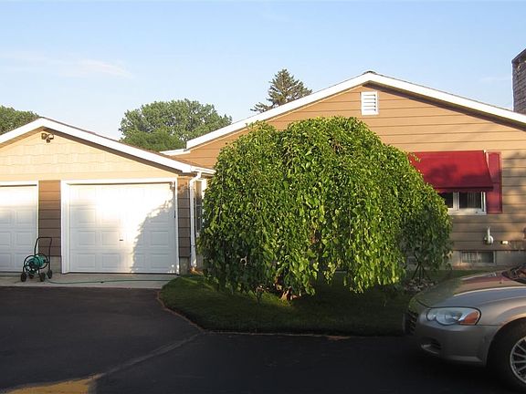 Attached two-car garage and roomy driveway for additional/guest parking
