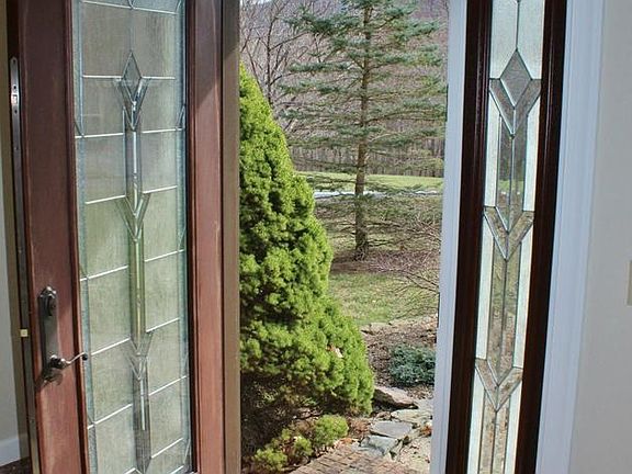 Tasteful marble foyer & leaded glass door entrance