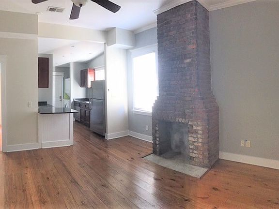 living room & kitchen (door to left to back bedroom)