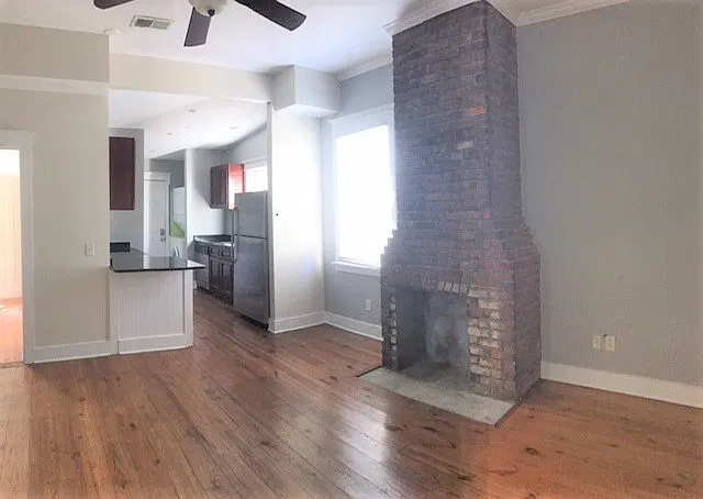 living room & kitchen (door to left to back bedroom)