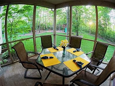 Porch. Delightful screened in porch overlooking the playground.