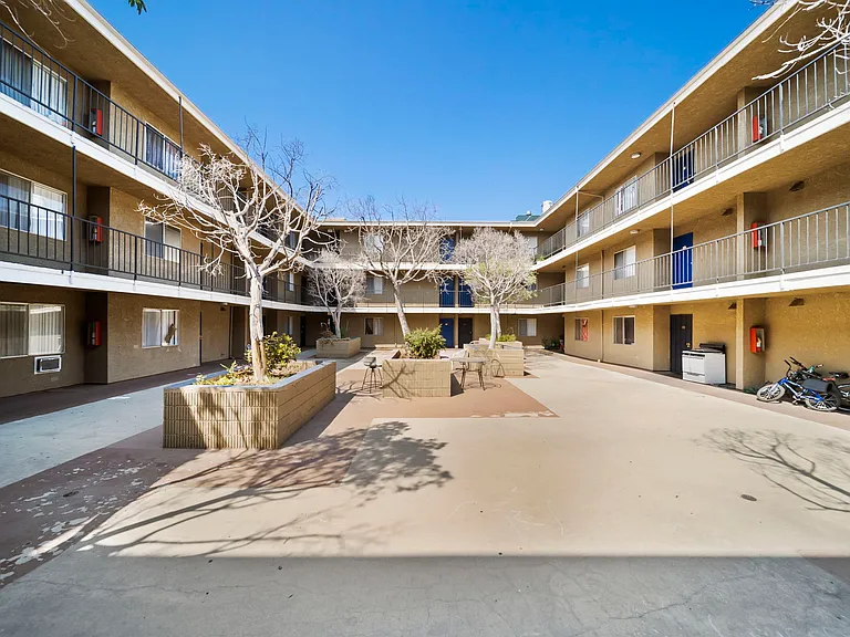 Open courtyard featuring a spacious layout and inviting common areas for residents.