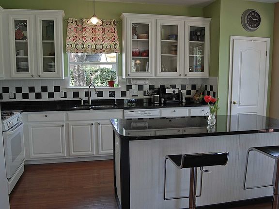 Beautifully designed & outfitted with granite countertops & custom cabinetry.