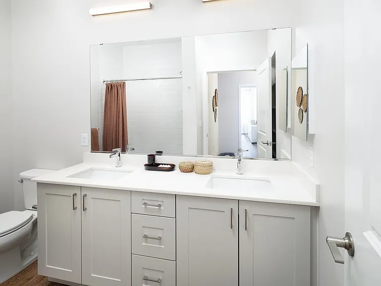 Design Collection II Bathroom with white quartz countertops, grey cabinetry, and hard surface flooring (Representative photo)