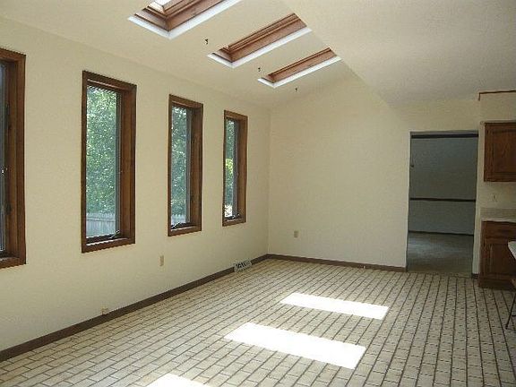 Breakfast Area with 4 skylights and overlooking the pool
