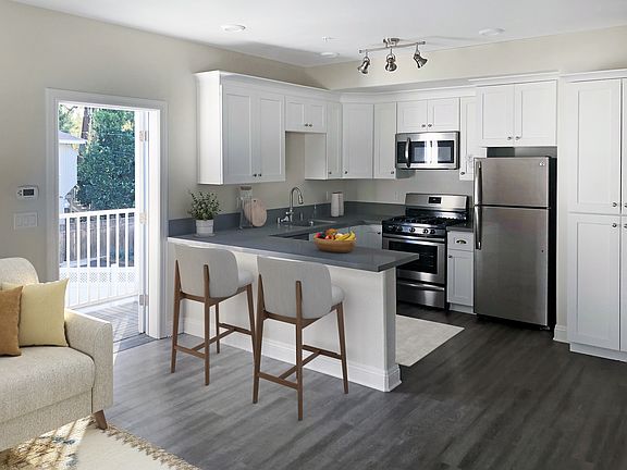 All stainless steel appliances, wood shaker cabinets and Quartz counters including the storage island.