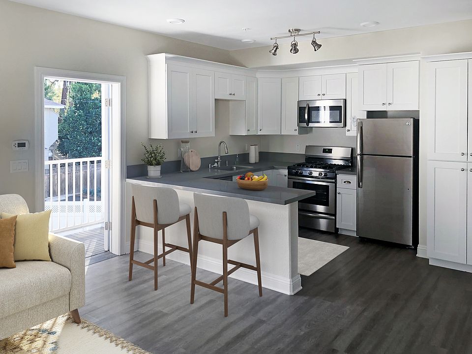 All stainless steel appliances, wood shaker cabinets and Quartz counters including the storage island.
