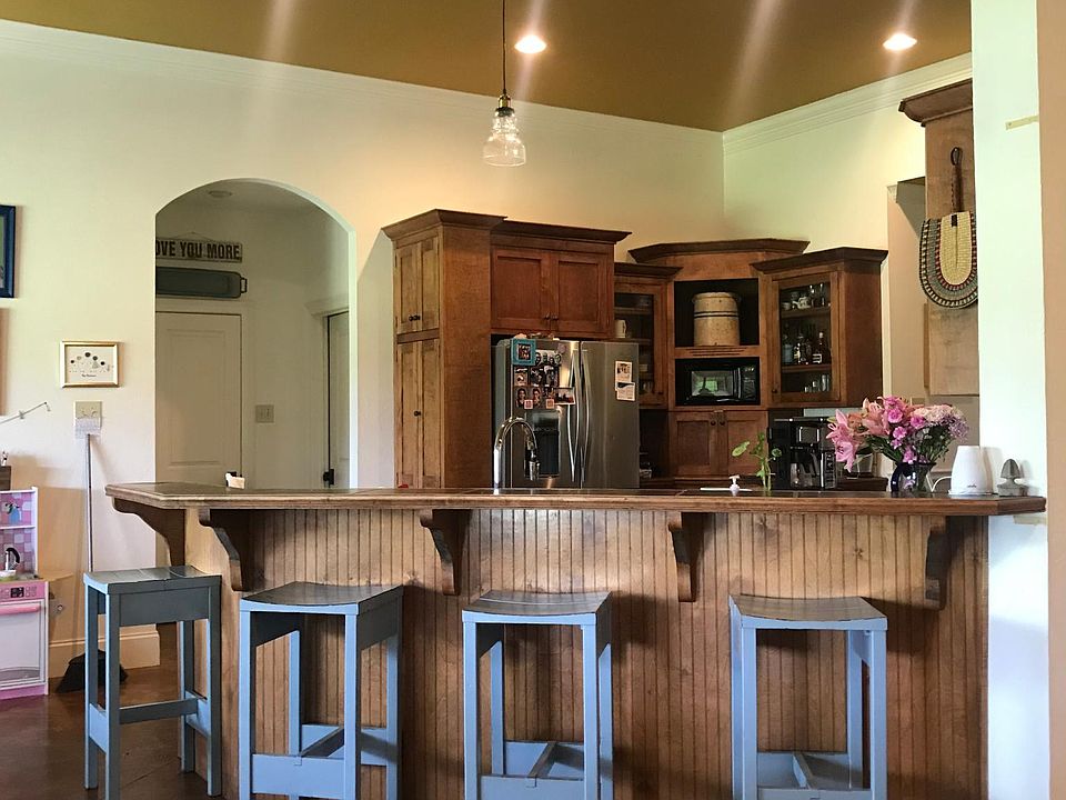 Custom kitchen cabinets and snack bar seating for 4