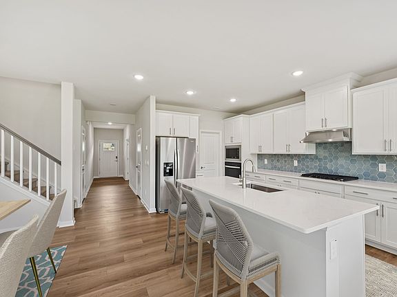 Kitchen in the Dakota floorplan at a Meritage Homes community in Garner, NC.