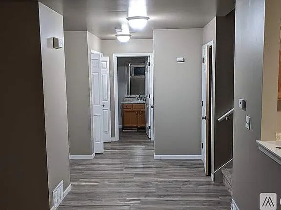 Lower level hallway. Lots of storage! 1/2 bath downstairs.