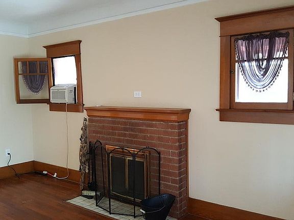Fireplace in front/living room, hardwood floors and coved ce