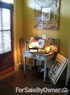 Foyer : Inviting entrance with double doors, buttery gold walls and beautiful lighting.