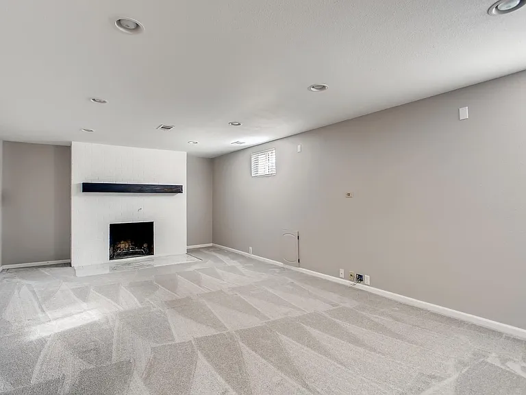Entertainment room in basement, new carpet