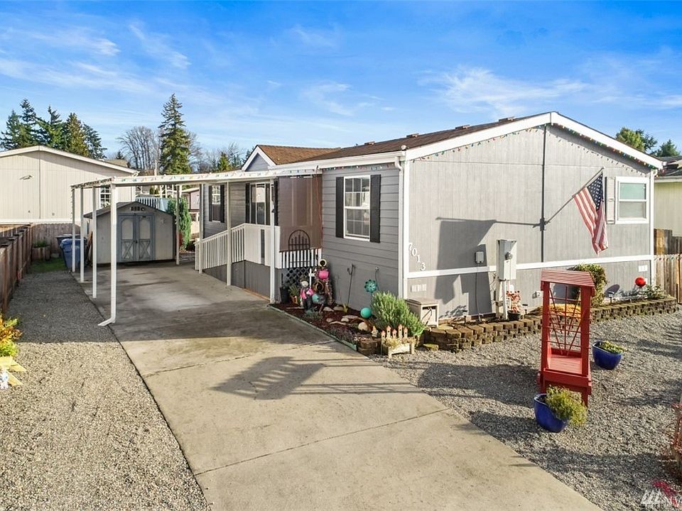 Welcome home to this lovingly maintained property in a quaint 55+ community where you own your lot! 