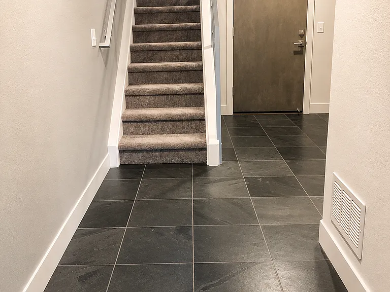 Open Stairway with Industrial Railing and Large Additional Storage Closet