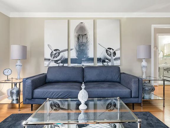 The living room features beautiful decor and plenty of seating.