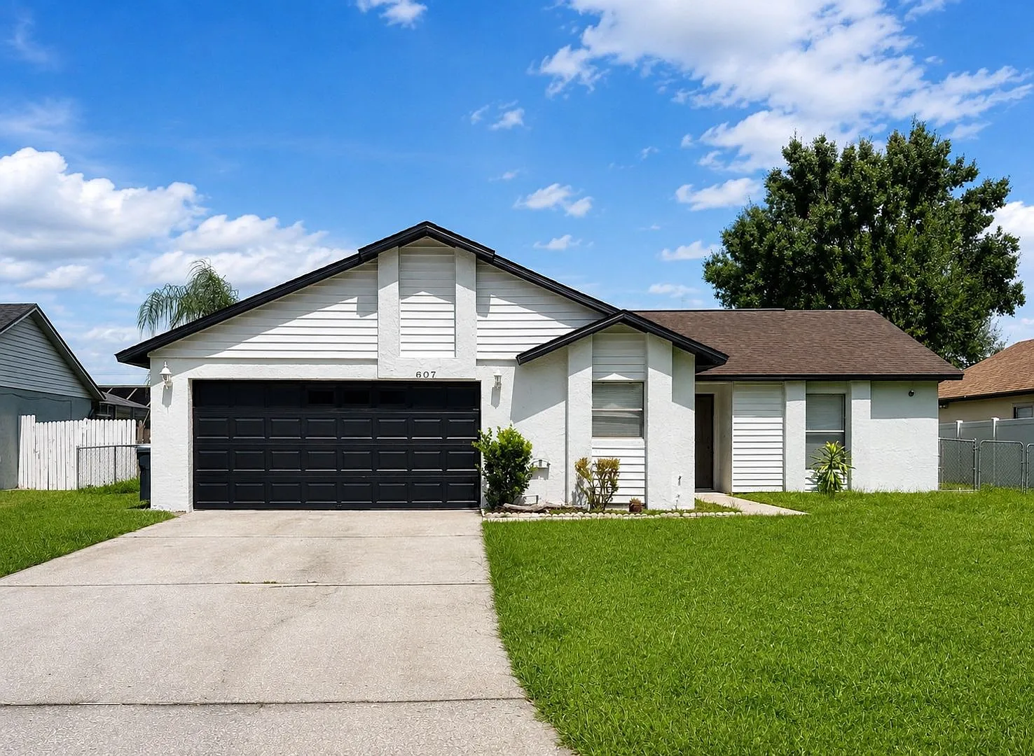 Move-In Ready Poinciana Gem with a Brand-New Kitchen & Screened Porch! — Photo 1
