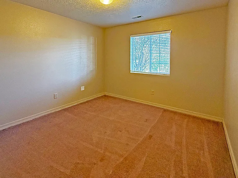 2nd Bedroom with window overlooking the street