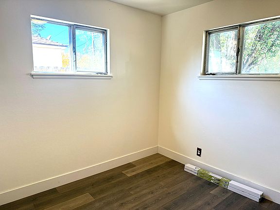 Bedrooms 2 and 3 have new grey laminate wood floors