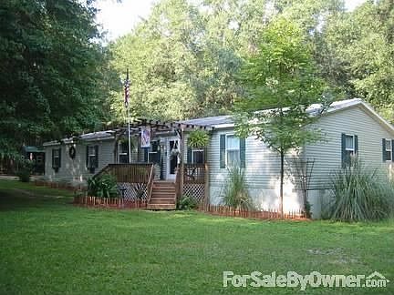 Nestled among majestic oaks and dogwoods : Well constructed, easy to maintain with plenty of shade t