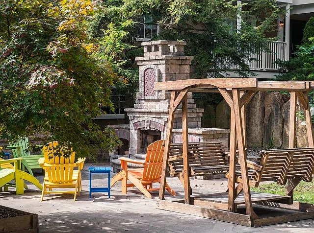 Unwind by the cozy outdoor fireplace at University Oaks Apartments near Kent State University.