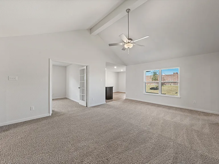 The family room of the Sabine has a large window with great natural light and back yard views.