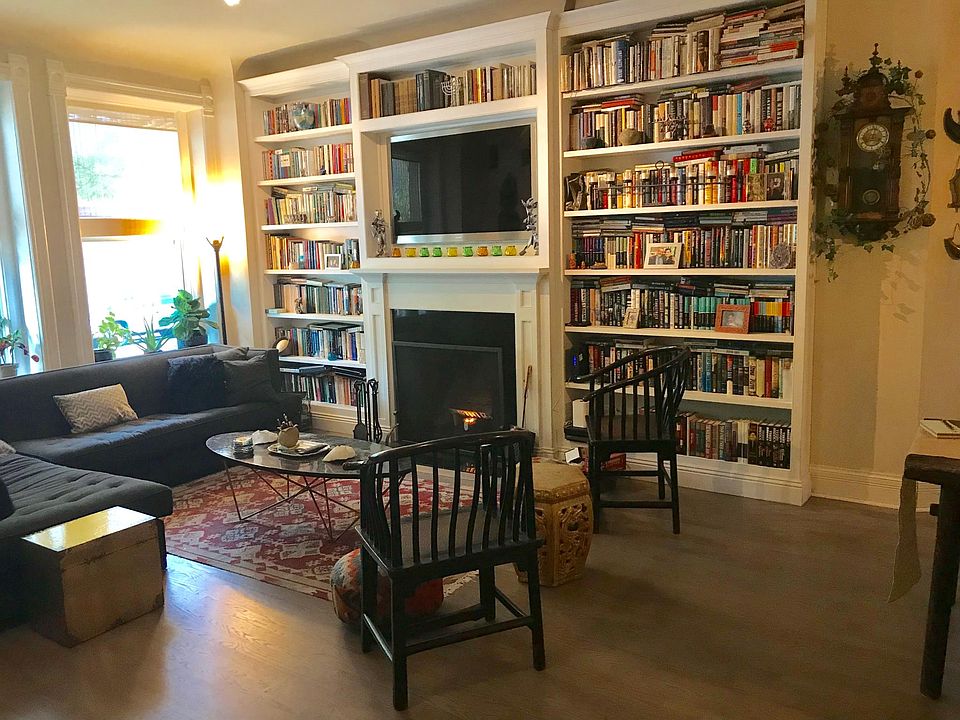 Living area with wood burning fireplace. 