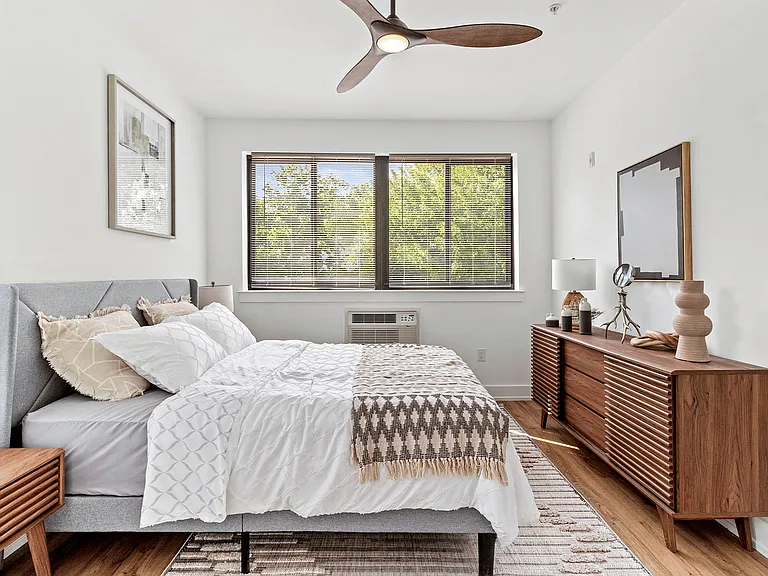 Step into this elegant bedroom retreat with modern design and inviting comfort.