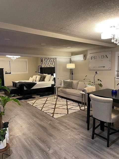 Opened sliding door between living room and bedroom.