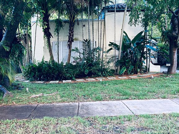 Beautifully Manicured Front Lawn of this Gorgeous Coral Gables Art Deco Home