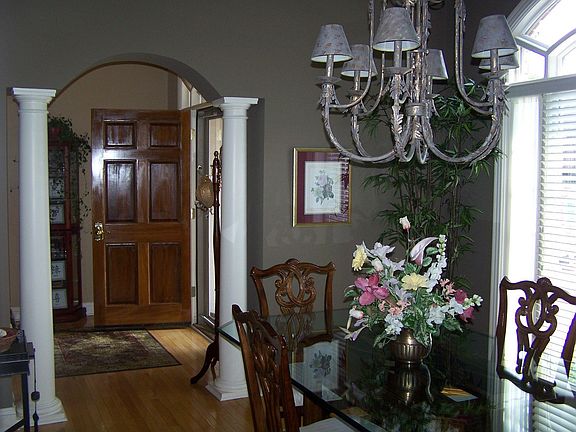 Dining room has arch entry way & french doors on the other side!