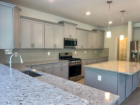 Stainless steel appliances/ceramic tile backsplash